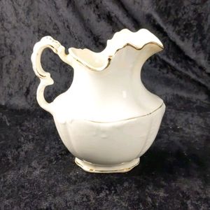 Antique Harvard ornate pitcher with gold trim